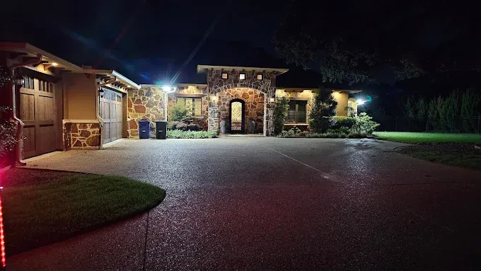 Perfectly installed modern LED lighting illuminates a sleek building in Fort Worth, TX, showcasing elegant design and landscaping.