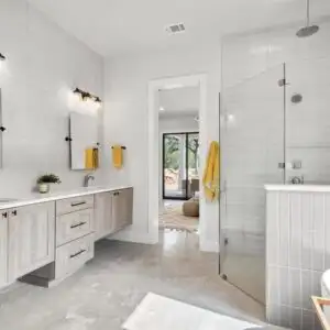 Completed home remodeling in Allandale TX featuring modern living space with high ceilings and elegant decor.