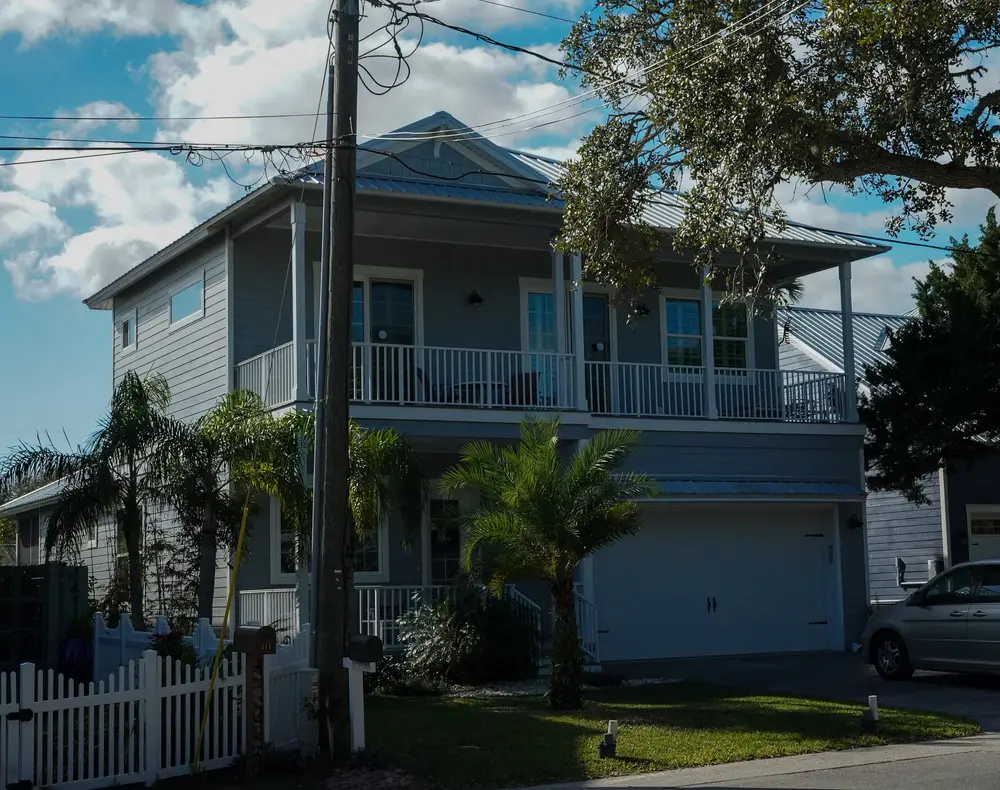 Vibrant commercial building in New Smyrna Beach, showcasing durable elastomeric waterproof coatings with lush landscaping.