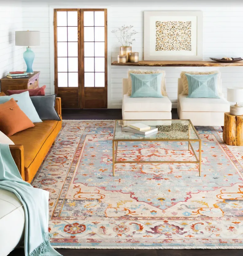Luxurious living room in Naples, featuring plush beige carpet, elegant furniture, and natural light.