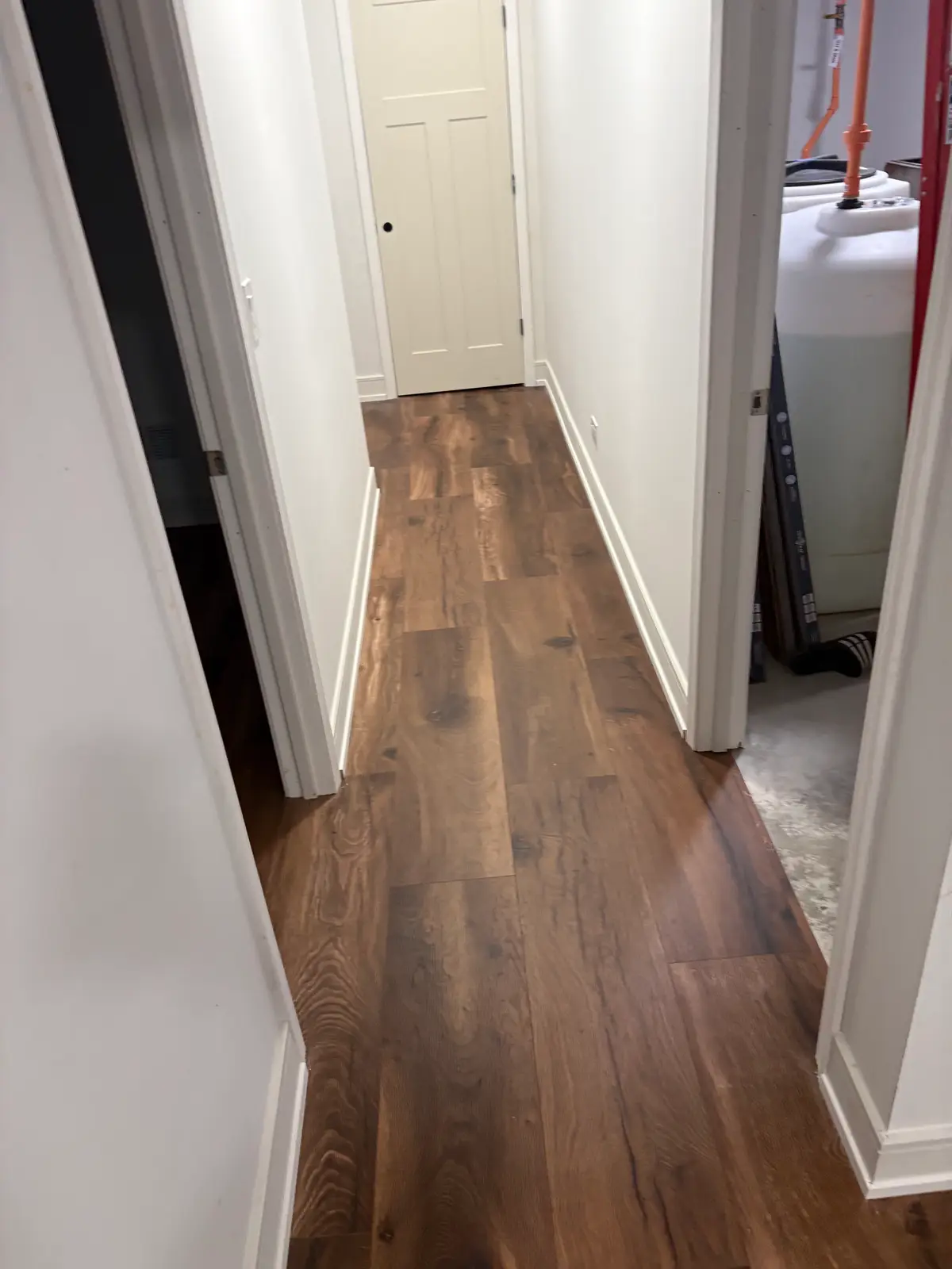 Hardwood floor installation in Darien IL, featuring polished oak in herringbone pattern with stylish decor and natural light.