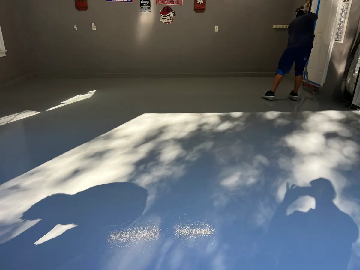 Glossy Polyurea floor coating in Jacksonville FL, showcasing vibrant colors in a clean, professional garage setting.