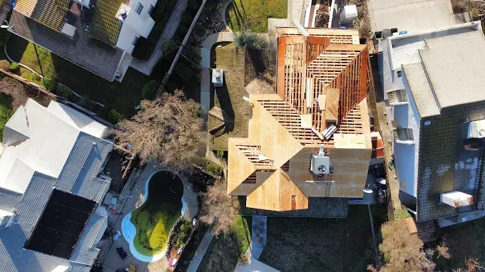 Freshly replaced roof on a home in Modesto, CA with textured shingles, clear sky, and inviting landscape.