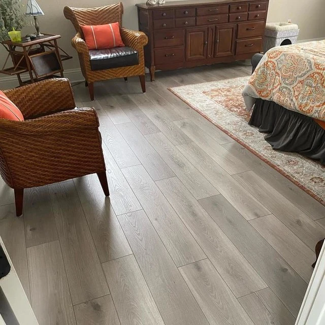 Spacious living room in Darien IL featuring elegant hardwood floors, modern furnishings, and soft natural light.