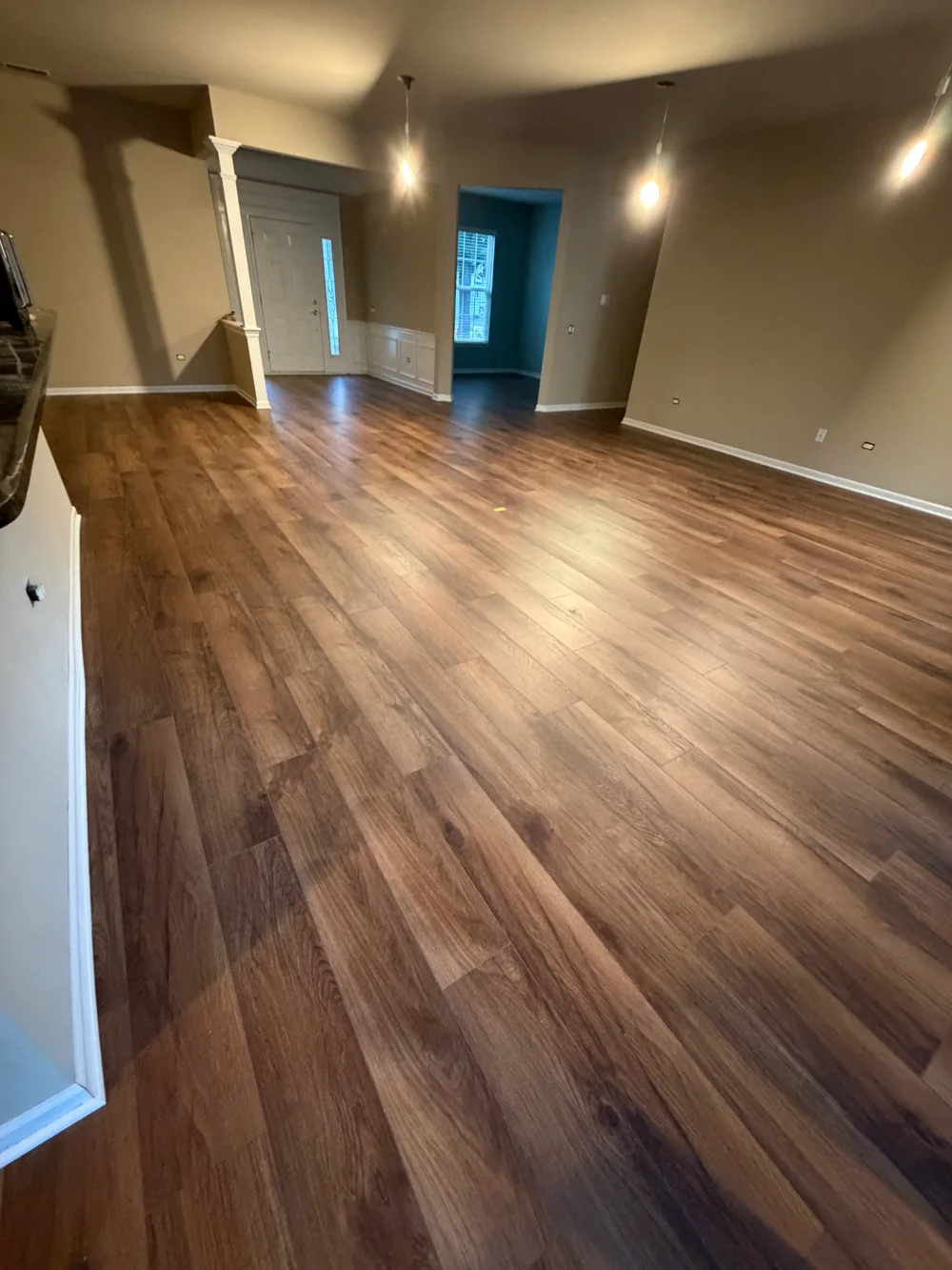 Engineered hardwood installation in Darien IL featuring rich wood grain, polished finish, and modern decor elements.