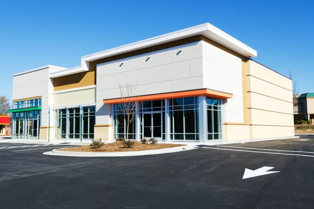 Vibrant commercial office in New Smyrna Beach with smooth blue and white walls, elegant furniture, and natural light.