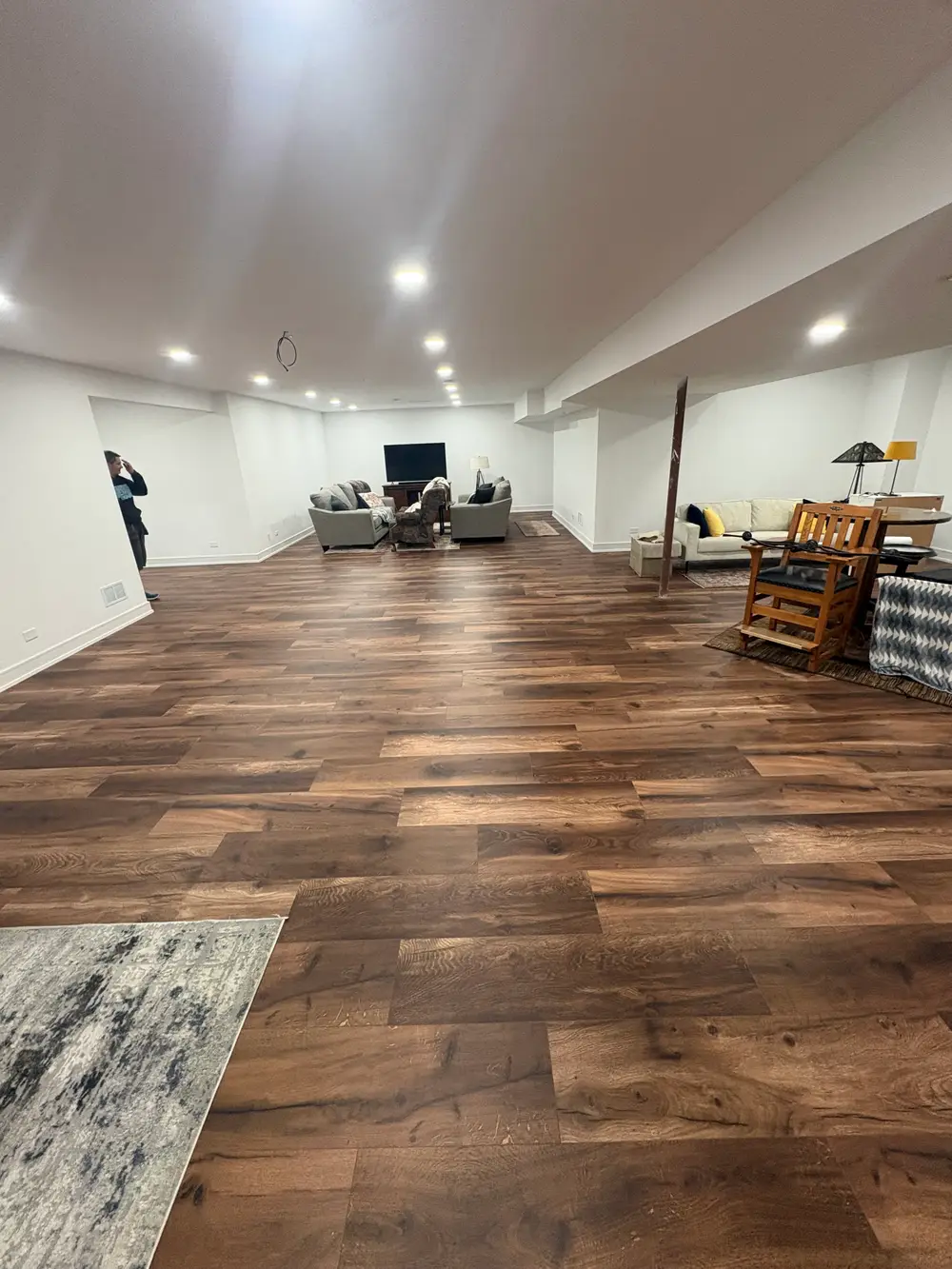 Engineered hardwood flooring in a spacious Darien IL living room with stylish decor and natural lighting.