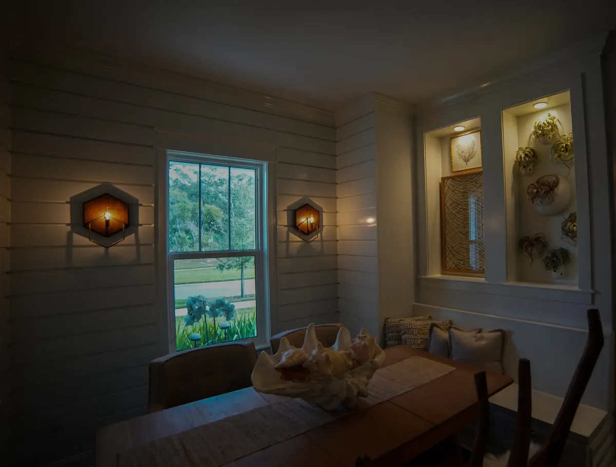 Drywall finishing and skim coating in a modern interior with smooth, white walls and soft natural light.