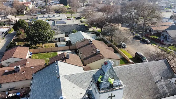 Completed attic ventilation upgrade with sleek roof vents on a modern Modesto CA home under a clear blue sky