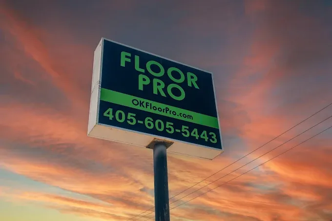 Showroom in Oklahoma City featuring diverse flooring options like hardwood, carpet, and tile in a polished setting.