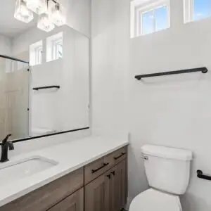 Completed home remodeling in Bee Cave, TX featuring a modern kitchen with high-end appliances and elegant decor.