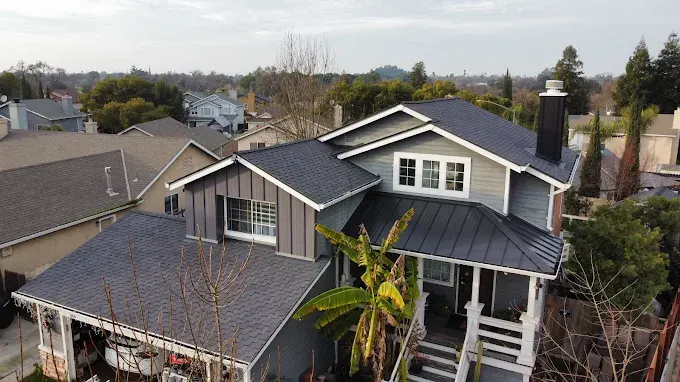 Seamless ridge vent installation on a modern roof in Modesto California with precise craftsmanship and lush surroundings