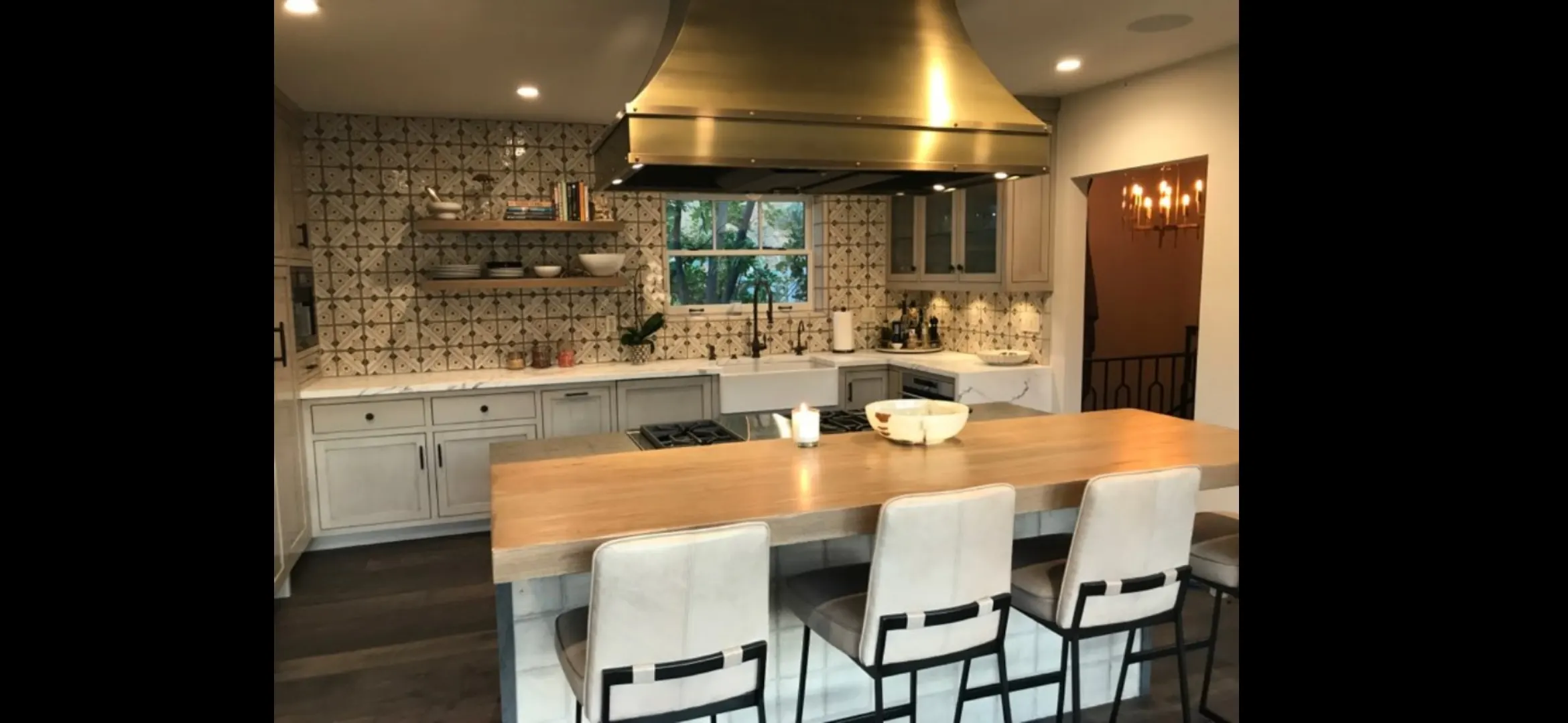 Modern kitchen remodel in Port St. Lucie FL featuring sleek cabinetry, quartz countertops, and large windows with natural light.