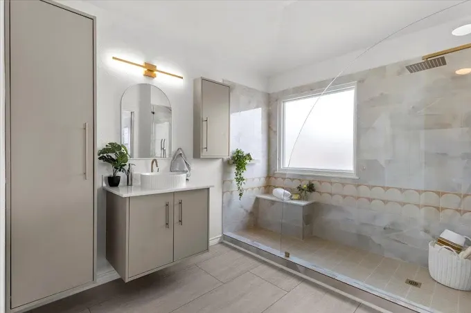 Home remodeling in Austin TX showcasing a modern kitchen and living space with stylish furnishings.