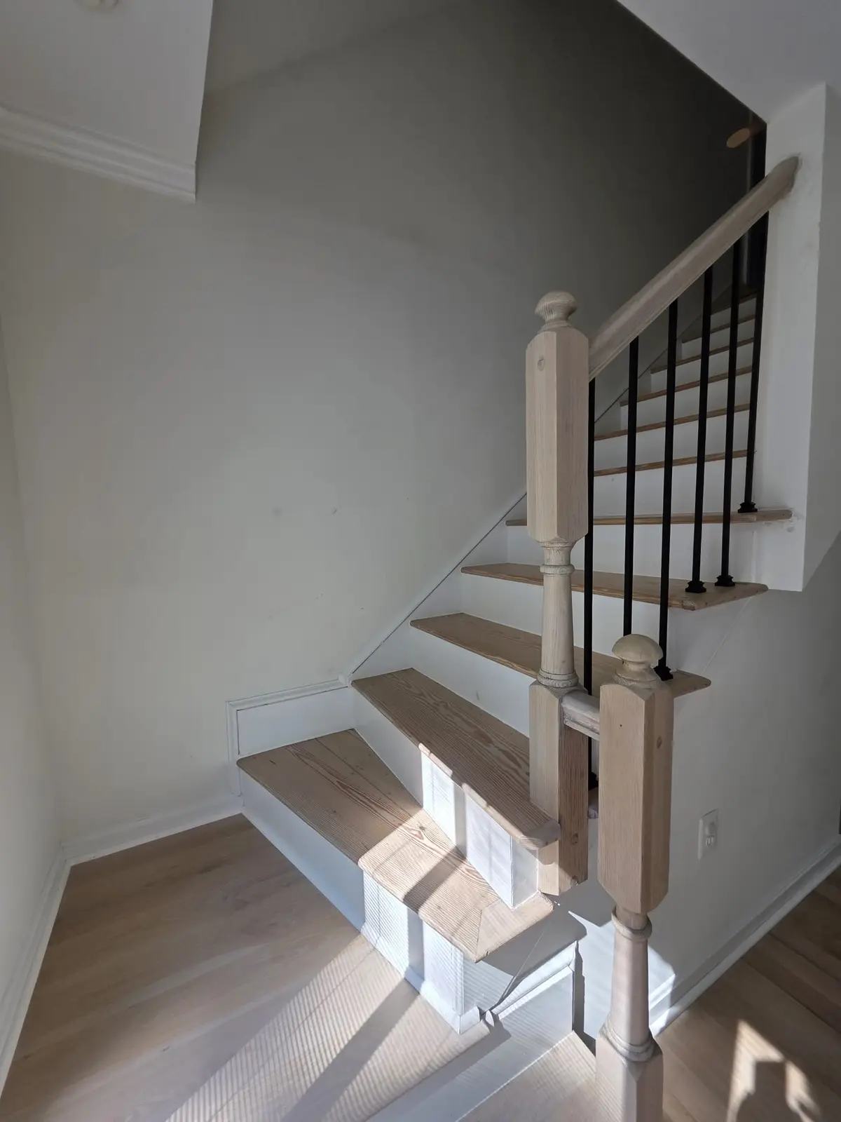 Completed LVP flooring installation in a spacious living area with modern decor and natural light highlighting its texture.