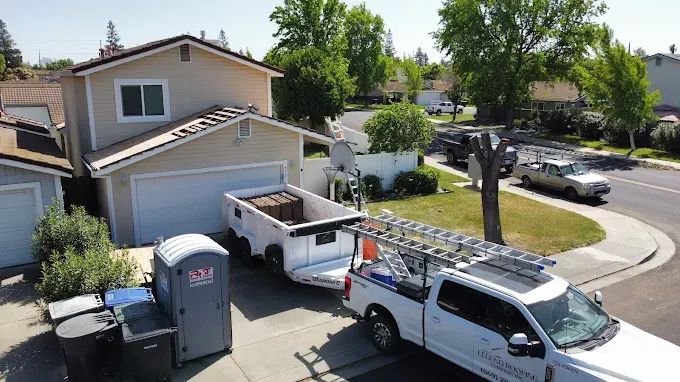 Close-up of a well-maintained gray shingle roof in Modesto California under bright natural light, showing expert craftsmanship and durability