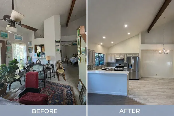 Remodeled kitchen in Austin with granite countertops, stylish island, stainless steel appliances, and lush backyard view.
