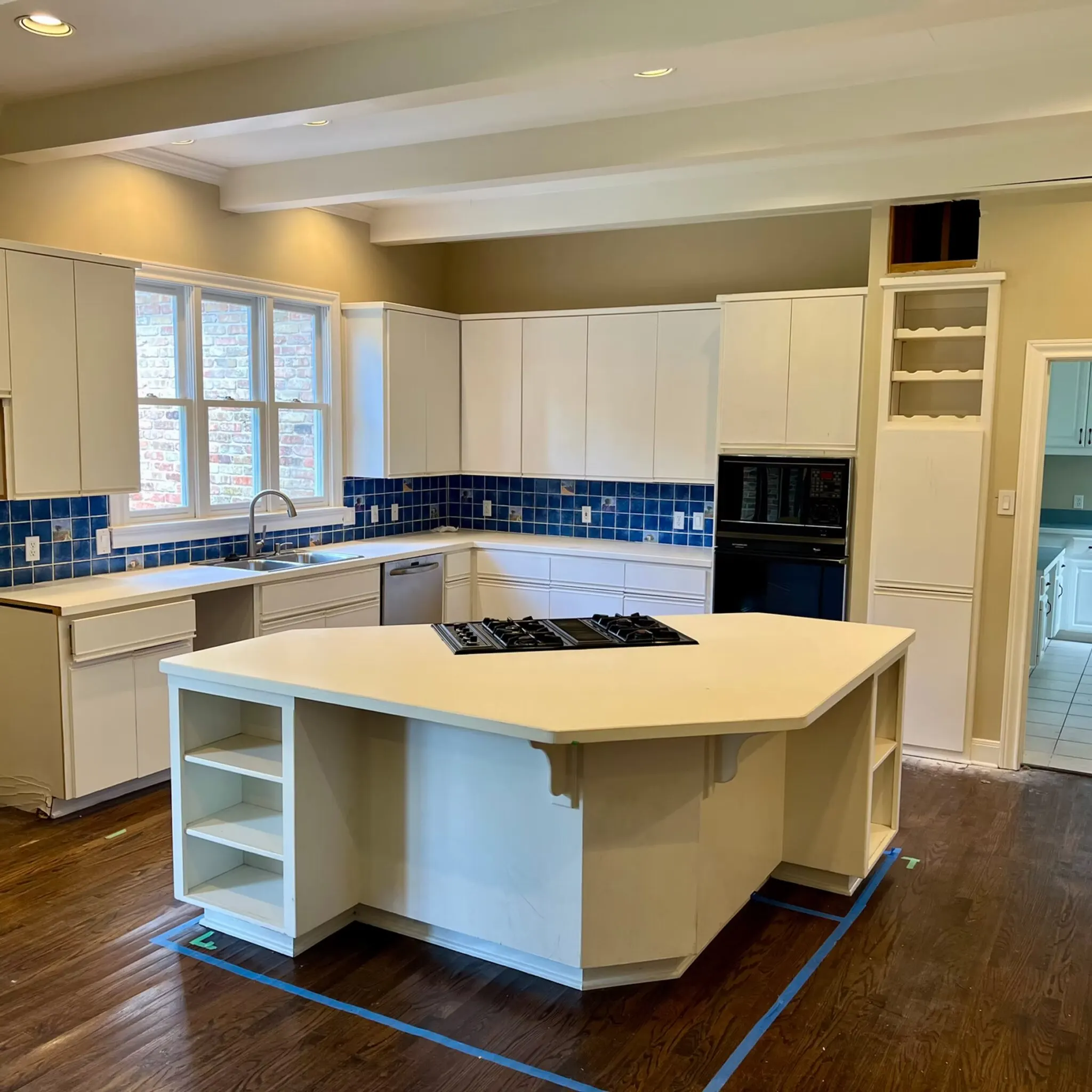 Modern Austin kitchen with polished granite countertop, stainless appliances, minimalist cabinetry, and natural light.