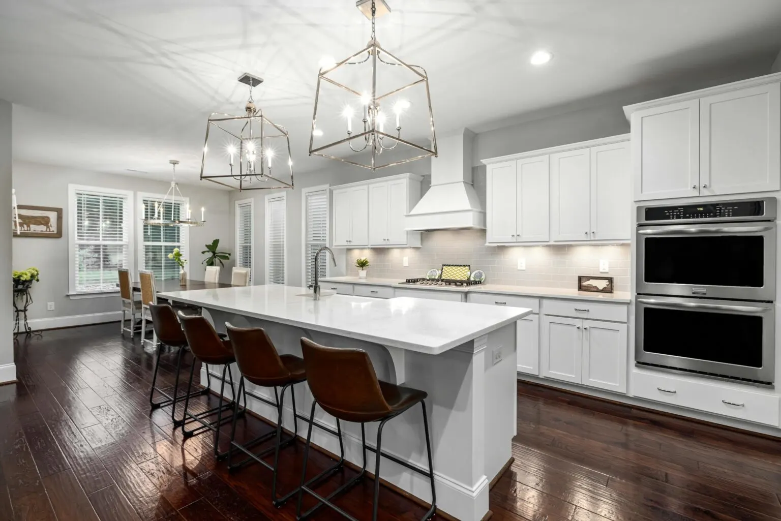 Modern living room in Belterra TX with open floor plan, sleek hardwood floors, stylish furnishings, and inviting ambiance.