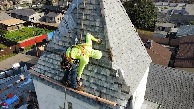 Completed roof flashing repair on a residential home in Modesto with detailed metal flashing, clean shingles, and scenic suburban background
