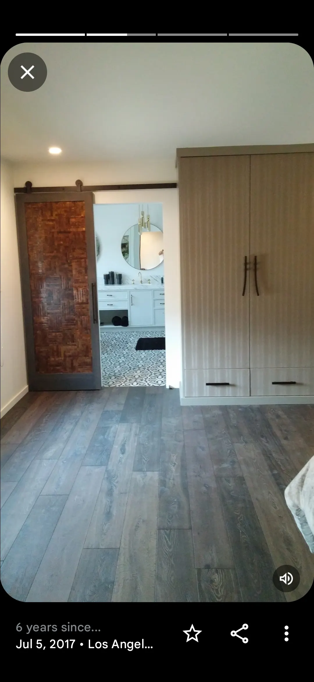 Remodeled Port St. Lucie bathroom with modern fixtures, soaking tub, marble shower, double vanity, natural light, and elegant decor