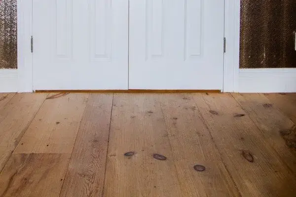 Hardwood floor refinishing projects in Naples FL showcasing beautiful polished wood surfaces