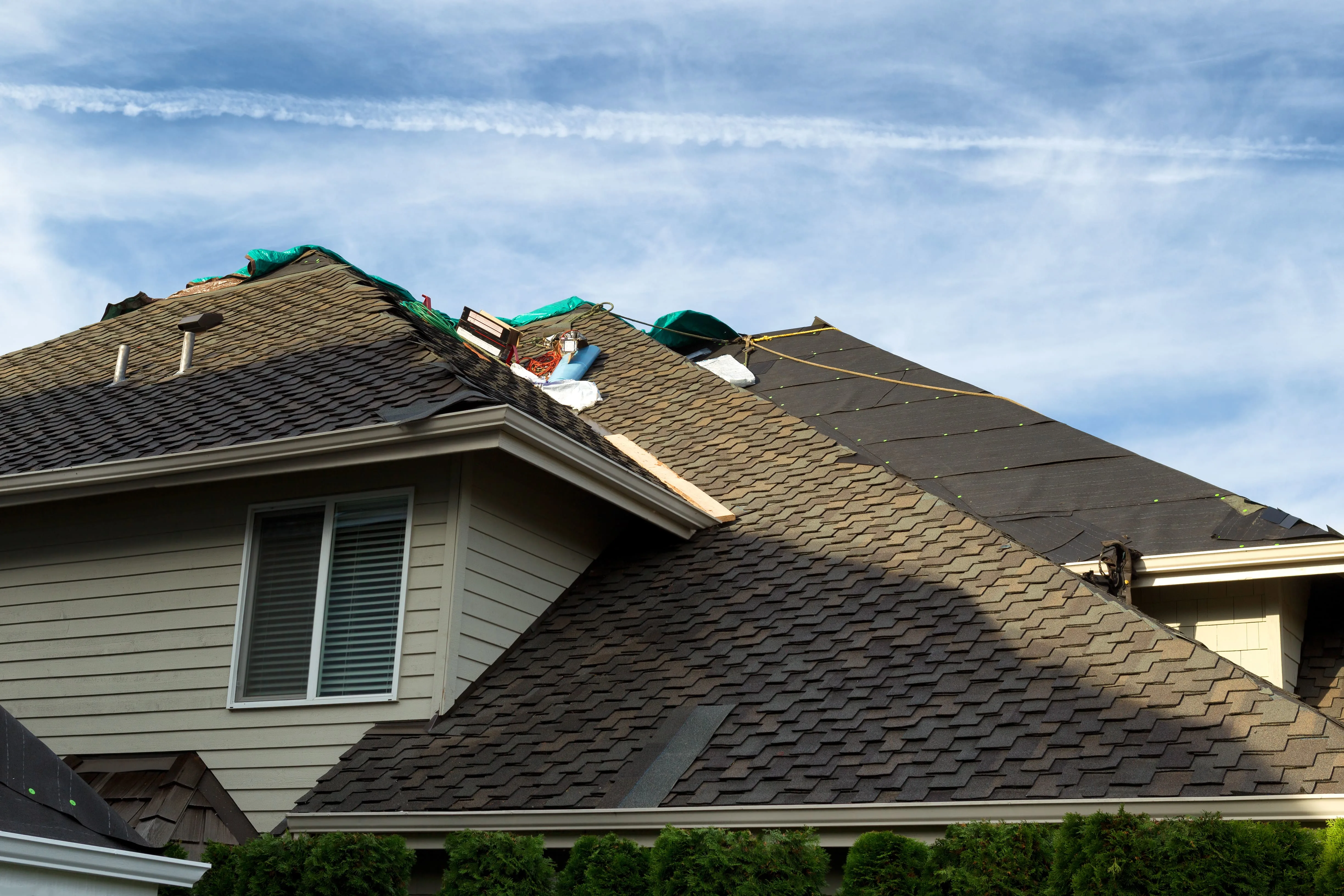 Roof leak detection on modern roof in Modesto CA with moisture meters thermal imaging sensors in a suburban neighborhood
