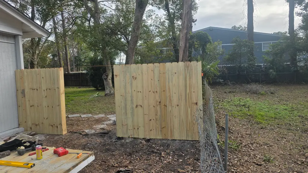 Fence installation project in St. Augustine FL showcasing a beautiful wooden fence in a residential yard