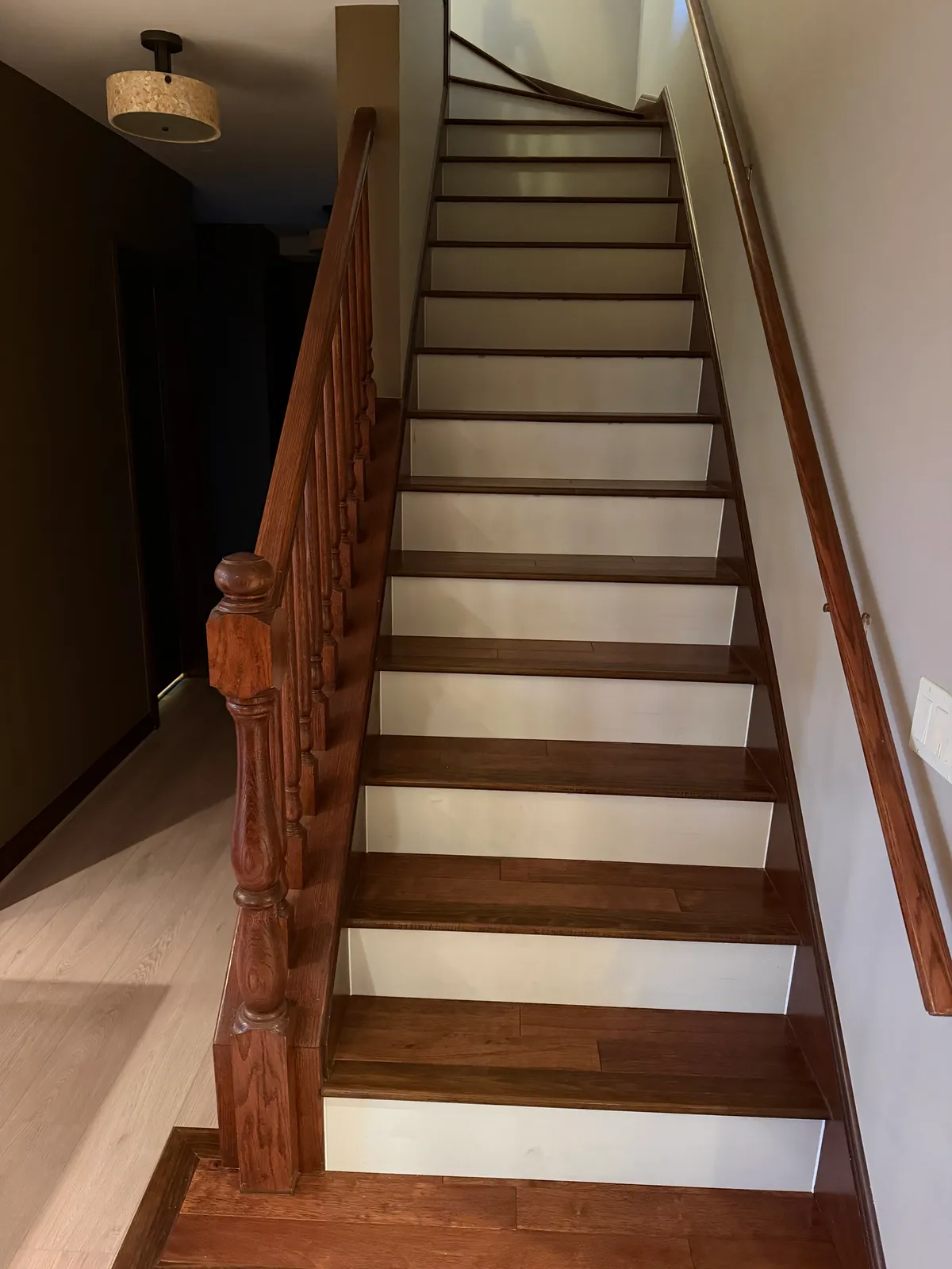 Spacious room with gleaming hardwood floors, natural light, neutral walls, and elegant baseboards in Darien IL.