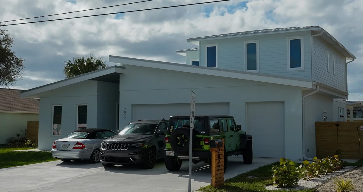 Concrete floor coating in a modern commercial space in New Smyrna Beach, featuring a glossy finish and elegant decor.