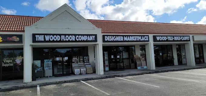 Hardwood floor staining in Naples, FL, showcasing rich tones and elegant coastal decor in a bright living space.