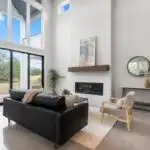 Modern kitchen remodel in Rollingwood TX with stainless steel appliances, wood cabinets, granite island, and natural light.