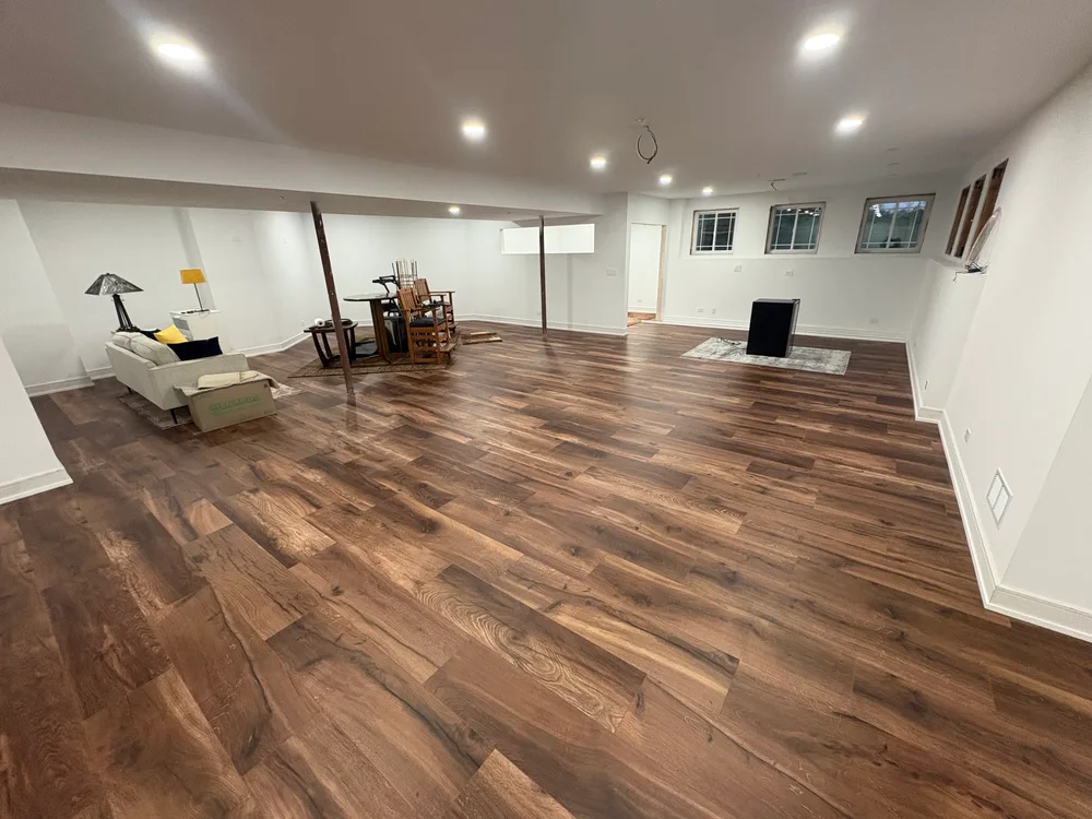 Completed subfloor replacement in Darien IL showcasing smooth surface, visible wood grain, and clean residential interior.