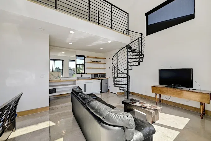 Completed home remodel in Barton Hills TX featuring a modern kitchen and spacious living area with custom design elements.