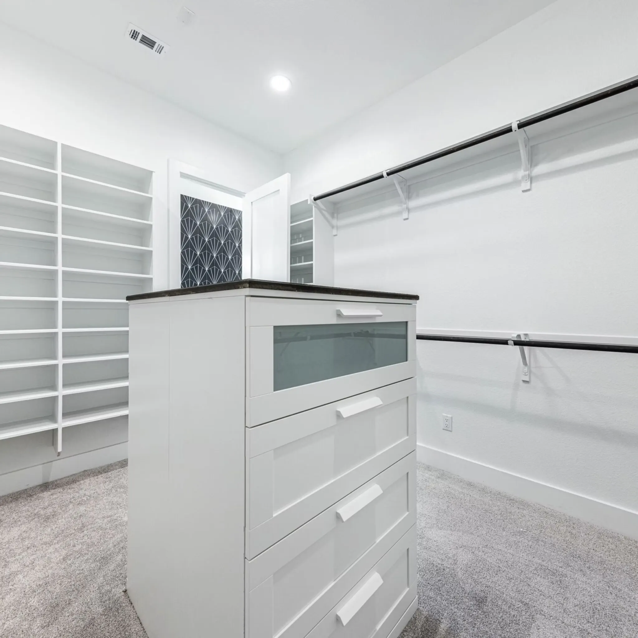 Modern kitchen and cozy living area in East Cesar Chavez TX, featuring elegant quartz countertops and stylish decor.