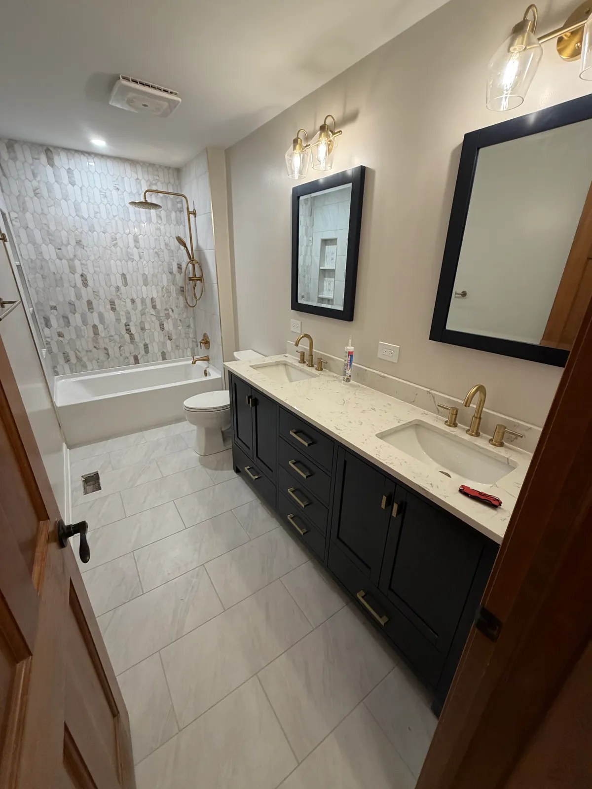 Luxury Vinyl Tile Flooring in a modern Darien IL living room with dark wood grain and elegant furniture accents.