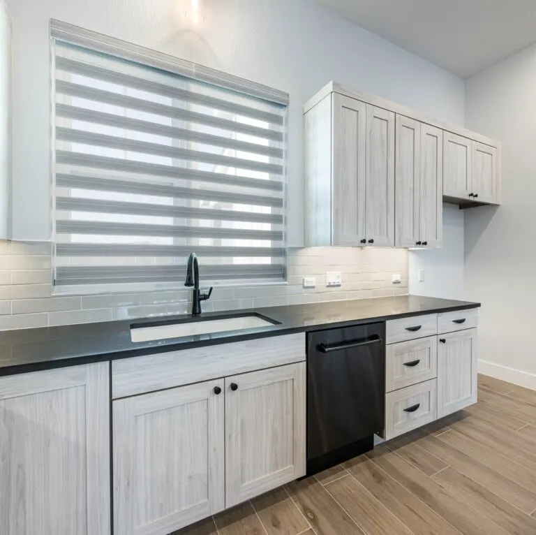 Spacious remodeled Crestview TX living area with modern decor, natural light, and elegant design elements.