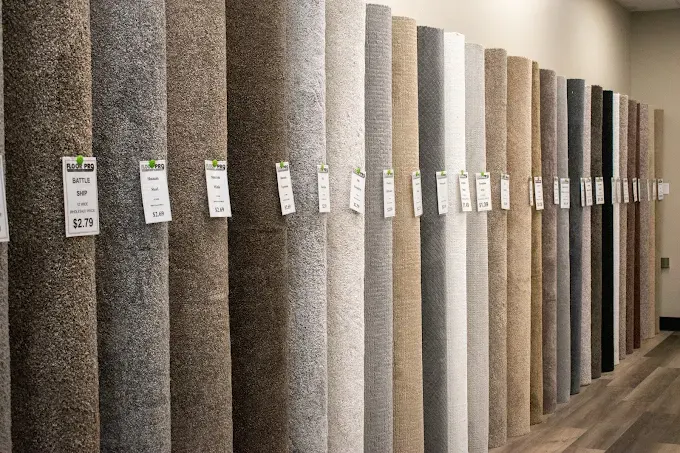 Flooring showroom in Oklahoma City showcasing hardwood, laminate, tile, and carpet in a welcoming professional space.