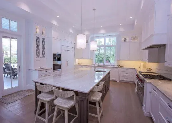 Pristine hardwood floor in Naples FL, showcasing glossy finish, natural light, and minimalistic elegant decor.