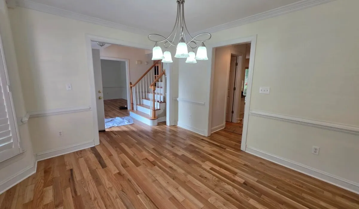 LVP stair nose installation in Centreville VA showcasing wood grain finish and polished surface in a modern staircase.
