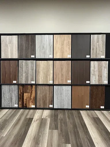 Showroom in Oklahoma City showcasing diverse flooring options like hardwood and tile in a stylish, inviting space.