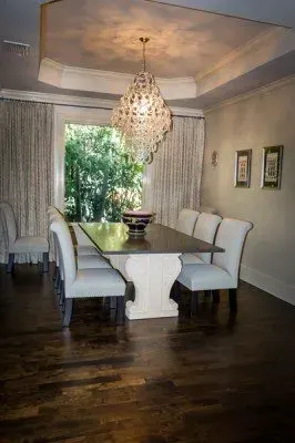 Completed wood flooring installation in Gateway FL, showcasing rich textures and warm tones in a stylish living room.