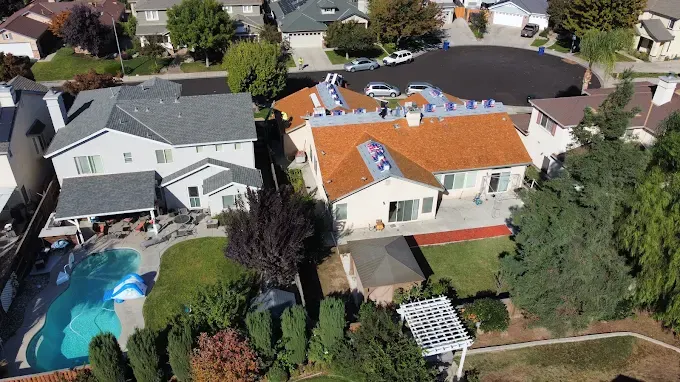 Newly completed roof replacement on a modern house in Modesto CA features high-quality asphalt shingles and clean edges.