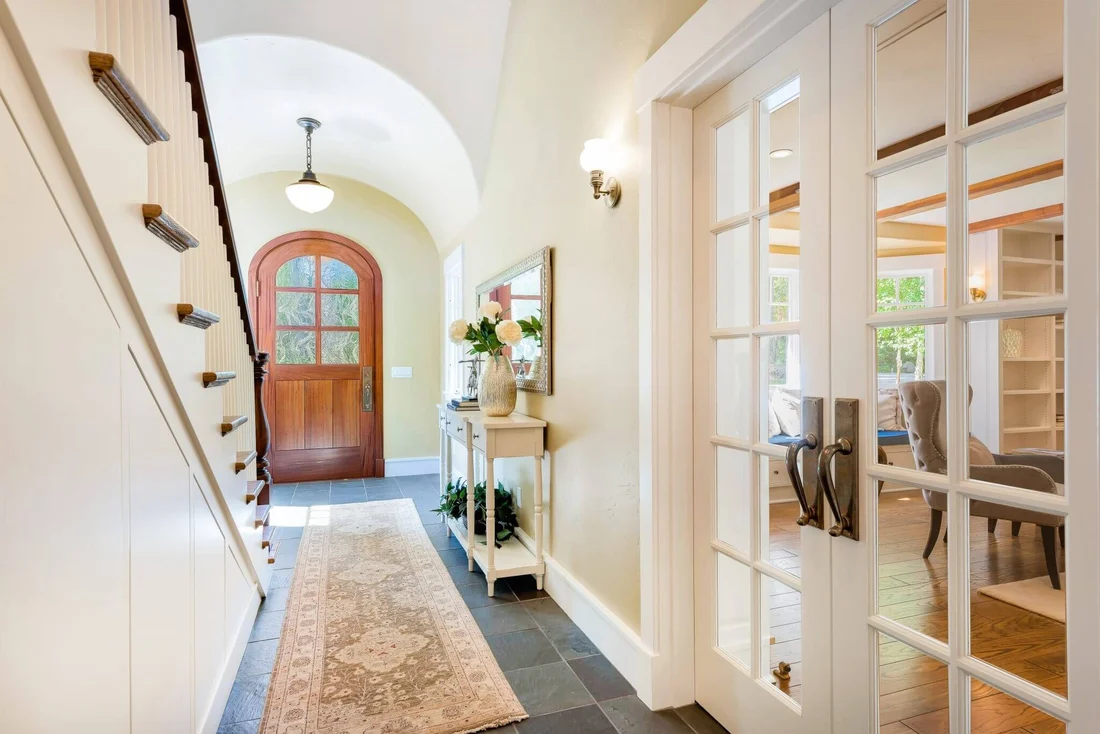 Wood ceiling painting in New Smyrna Beach, showcasing vibrant colors and intricate wood textures in a serene room.