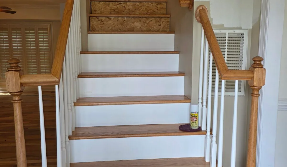 Luxury vinyl plank stair tread installation in Centreville VA showcasing elegant textures and modern design.