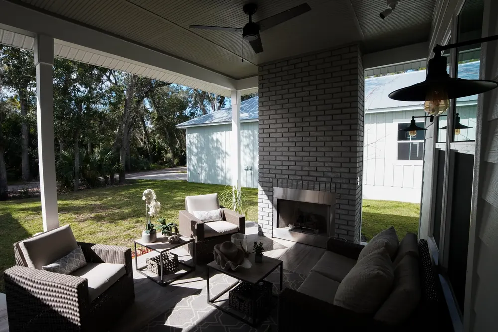 Stained tongue and groove ceiling in a coastal home in New Smyrna Beach, showcasing rich wood textures and warm tones.