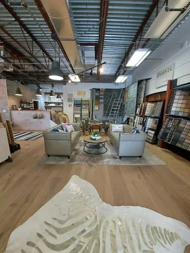 Beautifully refinished hardwood floor reflecting warm light in a stylish living space on Naples, FL.