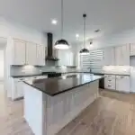 Freshly installed polished granite kitchen countertop in a modern Austin Texas home with sleek design and natural light