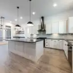 Modern open-concept living space in West Lake Hills TX with high-end finishes, natural light, and elegant decor.