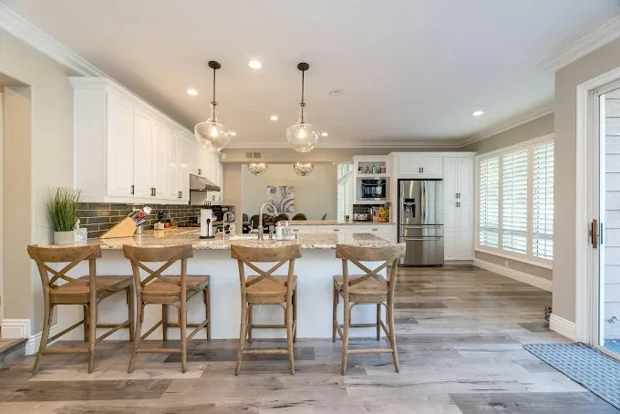 Newly built modern ADU in Austin TX with stylish design, durable siding, large windows, and lush landscaped yard